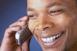 smiling_man_talking_on_cell_phone_11